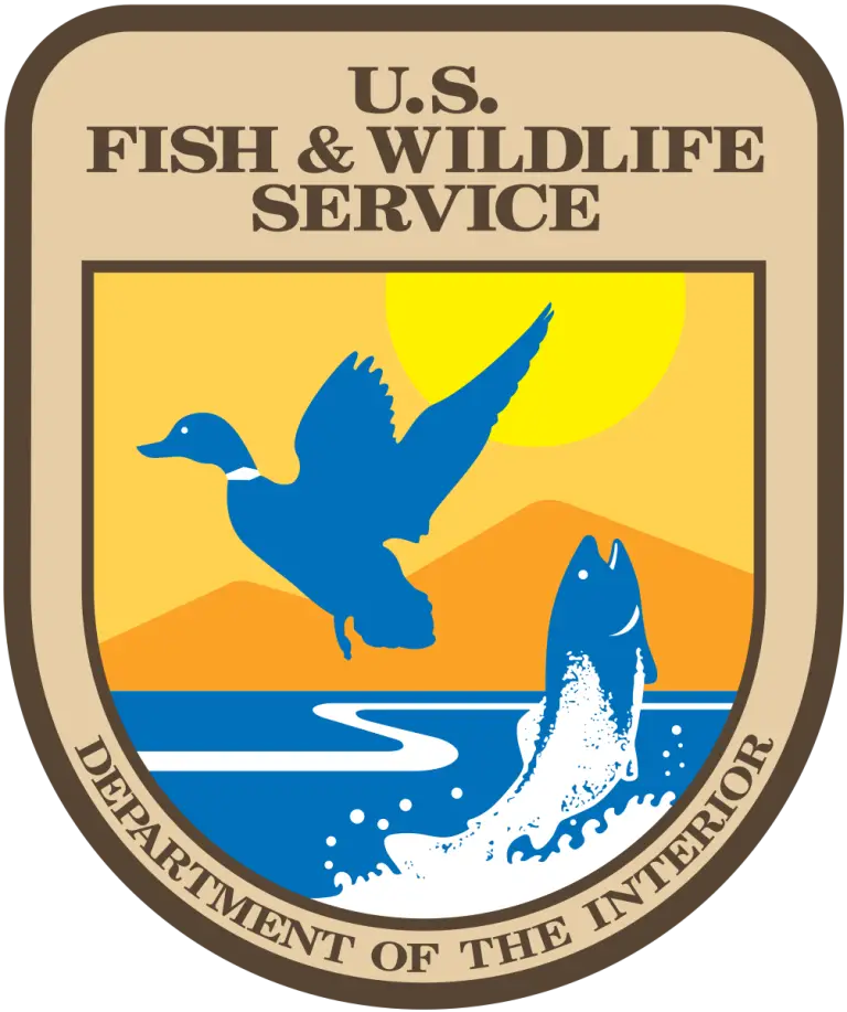 The U.S. Fish & Wildlife Service logo features a flying duck and a leaping fish against a yellow sun and mountains, with a blue river below. The text reads DEPARTMENT OF THE INTERIOR.